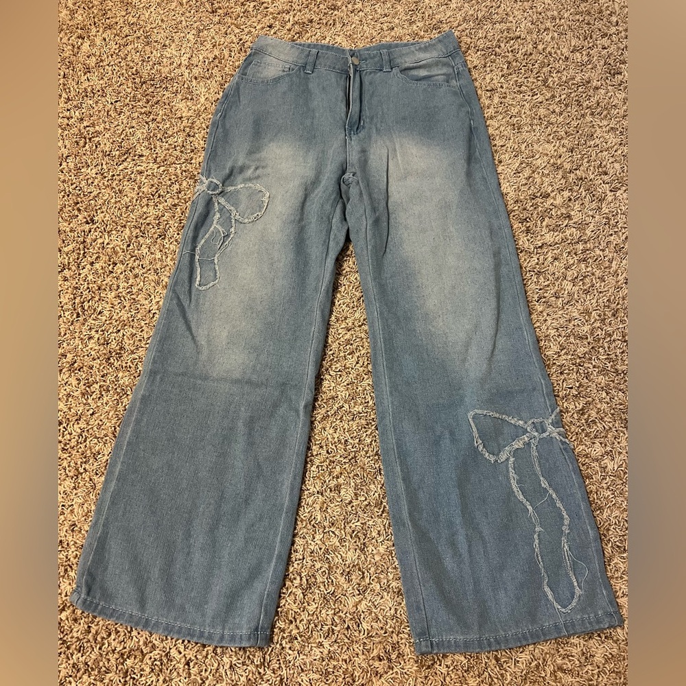 Jeans with bows. Size medium